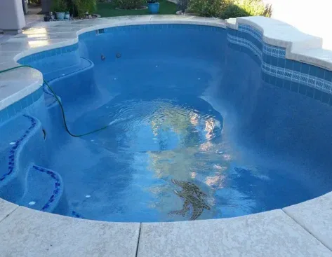 Attached image file Pool professionals resurfacing a swimming pool