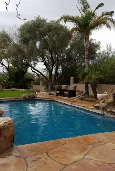 Beautiful Pool with Large Stones on the corners by Tempe pool contractors